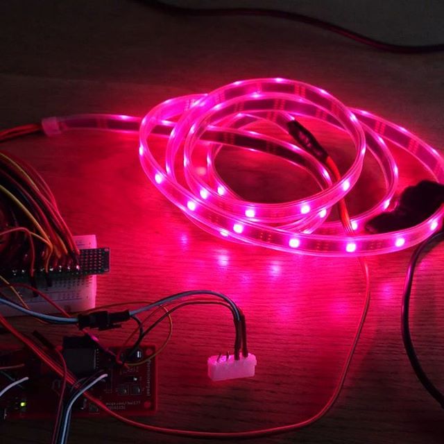 A strip of RGB LEDs lit up pink